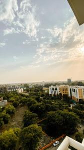 a view of a city with buildings and trees at AASHIYANA HOMESTEAD DLF My Pad in Lucknow