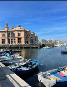 a group of boats docked in the water near a building at HOME SWEET HOME in Sammichele di Bari