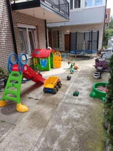 a backyard with childrens play equipment in a house at Stan na dan Emili 2 in Valjevo