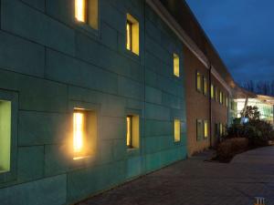 a building with lights on the side of it at ibis budget Beaconsfield in Beaconsfield