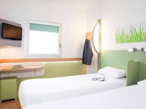 Postel nebo postele na pokoji v ubytování ibis budget Beaconsfield