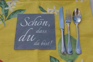 a napkin with a sign that says salmon class au au just at Ruhe genießen und wohlfühlen auf 70m² in Ober-Laudenbach