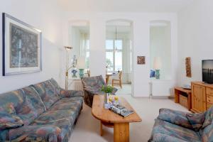 a living room with a couch and a coffee table at Dünenstraße 25 in Zinnowitz