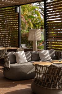 a living room with a couch and a table at Sir Anthony in Playa de las Americas