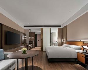 Ein Bett oder Betten in einem Zimmer der Unterkunft Hyatt Regency Shanghai Songjiang