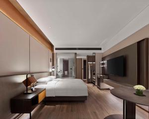 Ein Bett oder Betten in einem Zimmer der Unterkunft Hyatt Regency Shanghai Songjiang