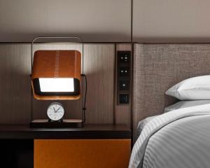 Ein Bett oder Betten in einem Zimmer der Unterkunft Hyatt Regency Shanghai Songjiang