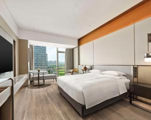 Ein Bett oder Betten in einem Zimmer der Unterkunft Hyatt Regency Shanghai Songjiang