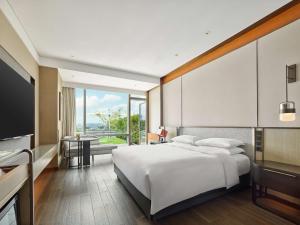 Ein Bett oder Betten in einem Zimmer der Unterkunft Hyatt Regency Shanghai Songjiang