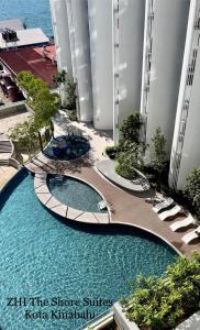 an overhead view of a pool in a resort at ZHI The Shore Suites Kota Kinabalu in Kota Kinabalu