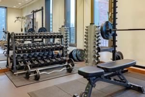 a fitness room with a gym with weights at Crowne Plaza Amsterdam - South by IHG in Amsterdam +215 photos