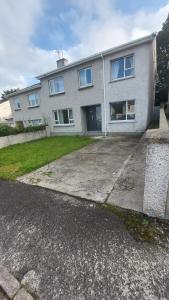 a large white house with a large driveway at My Little Home in Letterkenny