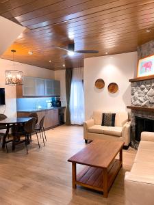 a living room with a couch and a table at Bpod Baguio in Baguio