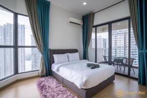 a bedroom with a bed and a large window at Scenic Country Garden Danga Bay by Lions Bay in Johor Bahru