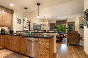 a kitchen with wooden cabinets and a counter top at B107 Beaver Creek Landing condo in Beaver Creek