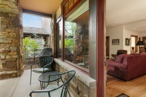a living room with two chairs and a couch at B107 Beaver Creek Landing condo in Beaver Creek +15 photos