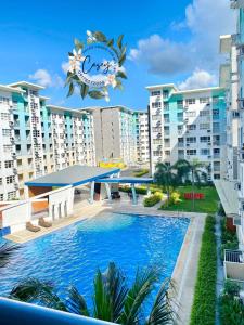 a view of the pool at a resort at Davao Condo 2BR Pool Wifi Netflix in Davao City