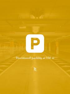 a poster of a parking lot with the p symbol at Prestige Rooms Chiaia in Naples +21 photos