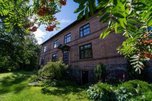 an old brick building on a green lawn at Mathildedal private holiday apartment nr. 7 in Mathildedal