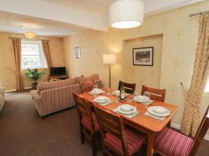 a dining room with a table and chairs at Garden Cottage No 2 in Keswick
