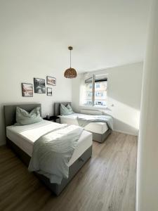 Säng eller sängar i ett rum på Dream Apartments