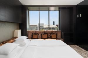 Krevet ili kreveti u jedinici u okviru objekta Falkensteiner Hotel Belgrade Superior