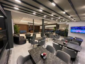 TV a/nebo společenská místnost v ubytování Alessia Hotel