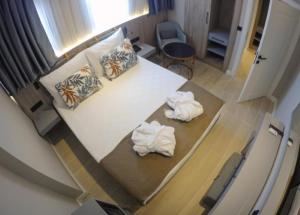 Postel nebo postele na pokoji v ubytování Alessia Hotel