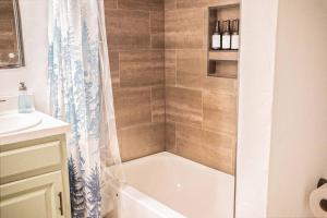 a bathroom with a bath tub and a shower at Casa on the Cove in Chandler +15 photos