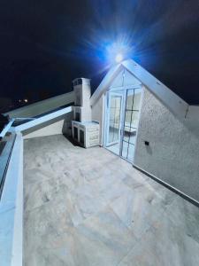 a house with a light on the roof at night at Marmara luxury villa in Marmaraereglisi