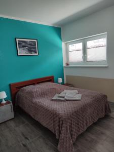 Llit o llits en una habitació de Apartamenty Bulwar Nadmorski, Rowy