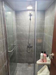 a shower with a glass door in a bathroom at Good Guesthouse #2 in Seoul