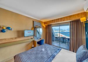 Postel nebo postele na pokoji v ubytování Numa Port Hotel