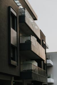 an external view of a building with balconies at Pearl Apartel in Volos