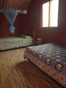Un pat sau paturi într-o cameră la Meemure WENASA HOTEL