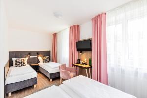 Postel nebo postele na pokoji v ubytování Home Hotel