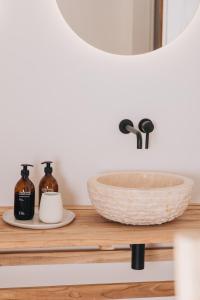 a bathroom counter with a sink and a mirror at V Bezovém Údolí in Kryštofovo Údolí