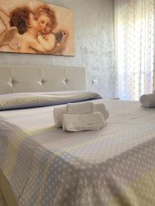 En eller flere senge i et værelse på Bilocale, via Udine 11 R, Gallipoli, Amiciziaweb