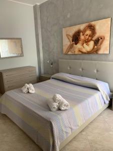 En eller flere senge i et værelse på Bilocale, via Udine 11 R, Gallipoli, Amiciziaweb + 2 billeder