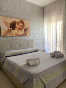 En eller flere senge i et værelse på Bilocale, via Udine 11 R, Gallipoli, Amiciziaweb