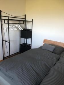 a bedroom with a bed with a metal bunk bed frame at Ferienwohnung auf dem Maifeld in Gappenach