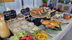a buffet of food with sandwiches and fruit on a table at Herdade Monte Novo Do Pocinho in Cercal