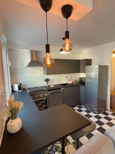 Η κουζίνα ή μικρή κουζίνα στο Bel appartement Meyzieu centre proche Tramway