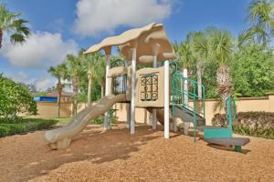 a playground with a slide in a park at Regal Palms Lovely 3 Br Sleeps 8mins To Disney in Davenport