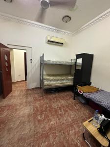 a room with two bunk beds in a room at Bed Space for Female single and bunk bed Al Sayed Builidng - Sharaf DG Exit 4 Flat 301 in Dubai