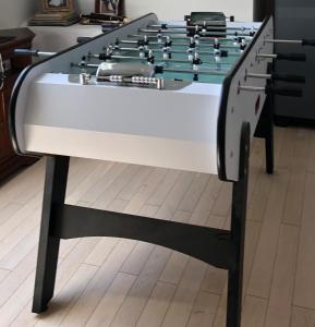 a large foosball table in a living room at Elen's home at the Bucorde in Montville