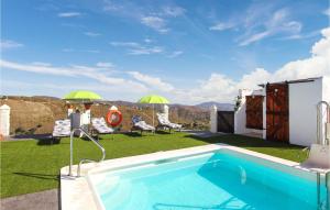 a swimming pool on the roof of a house at 4 Bedroom Gorgeous Home In Sedella in Sedella