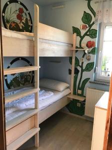 Postel nebo postele na pokoji v ubytování Bungalow 30 "Medita"