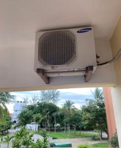 a air conditioner hanging from the ceiling of a building at Beachfront Studio-Waves & Wanderlust Haven in Mombasa