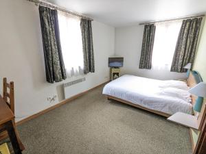 Postel nebo postele na pokoji v ubytování Hotel le Chasseur